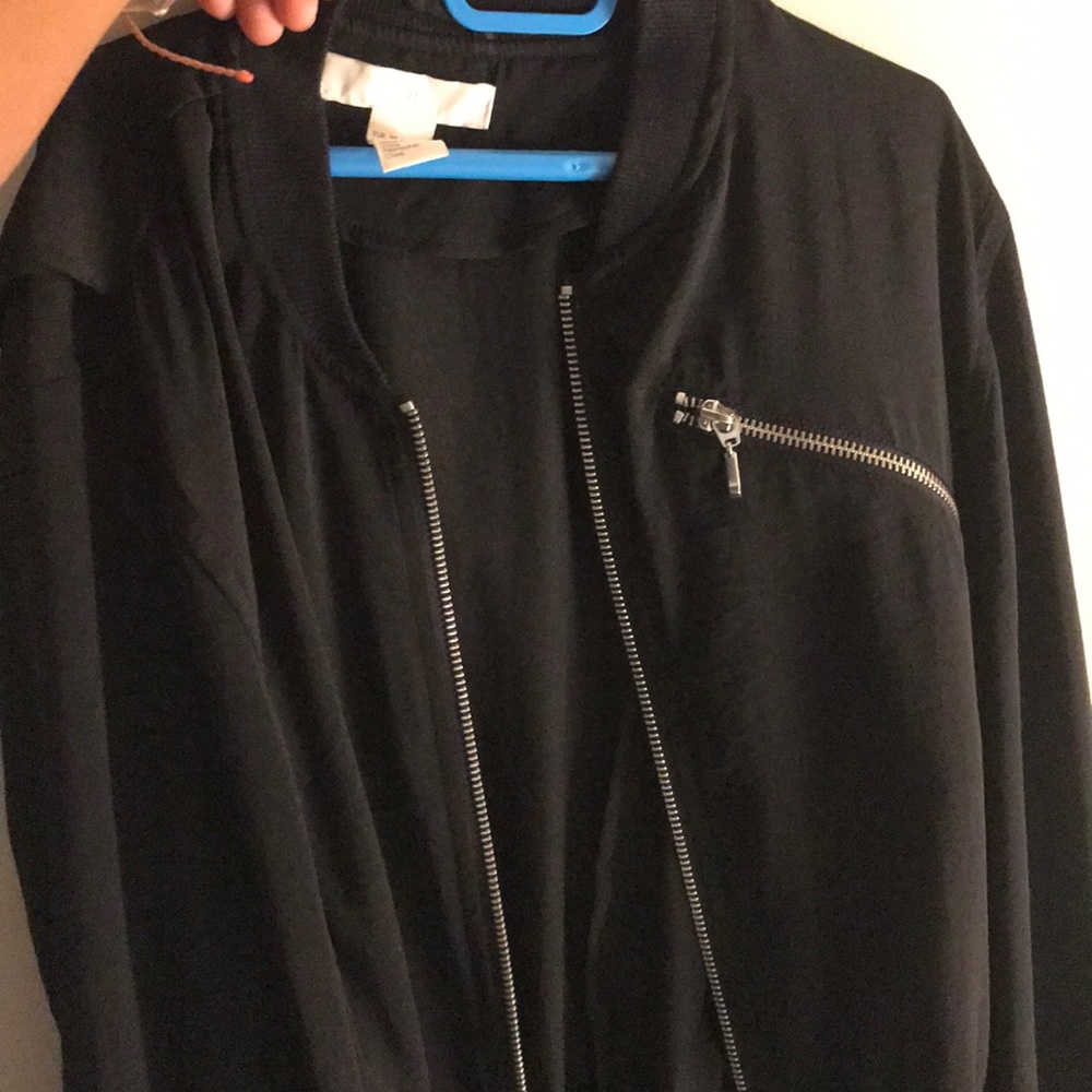 black bomber jacket with silver zipper